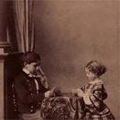 Two children playing cards
